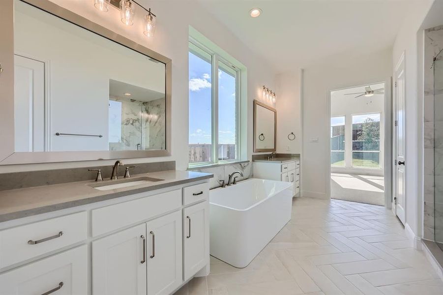 Bathroom featuring vanity, ceiling fan, shower with separate bathtub, and parquet floors