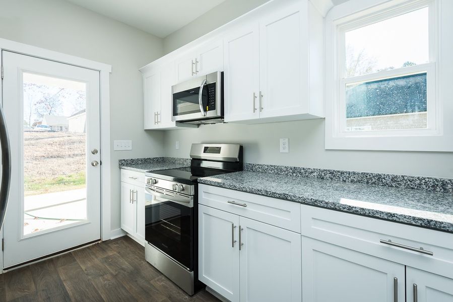 Representative furnished interior of a home built from the Thomas by Foundation Home Builders LLC in Pinnix Loop, Burlington (Image 7).