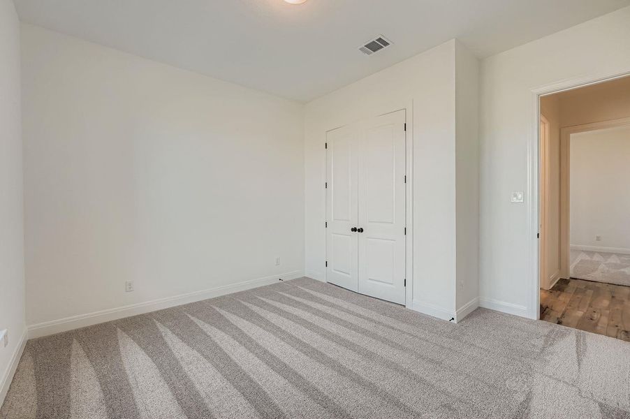 Spacious, unfurnished interior of a new home in 6 Creeks, Kyle (Image 10).