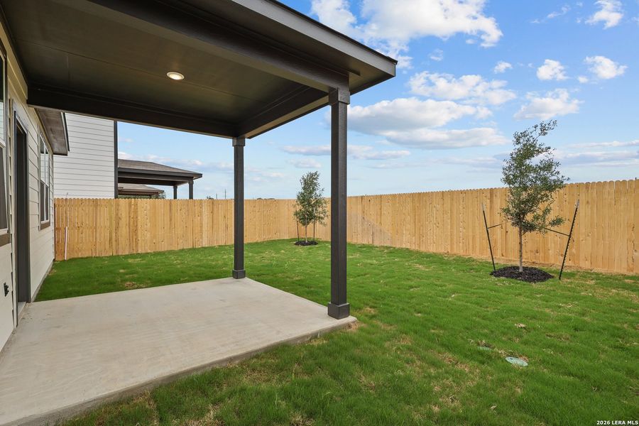 Exterior details and patio area of a home in Spring Creek, San Antonio (Image 21).