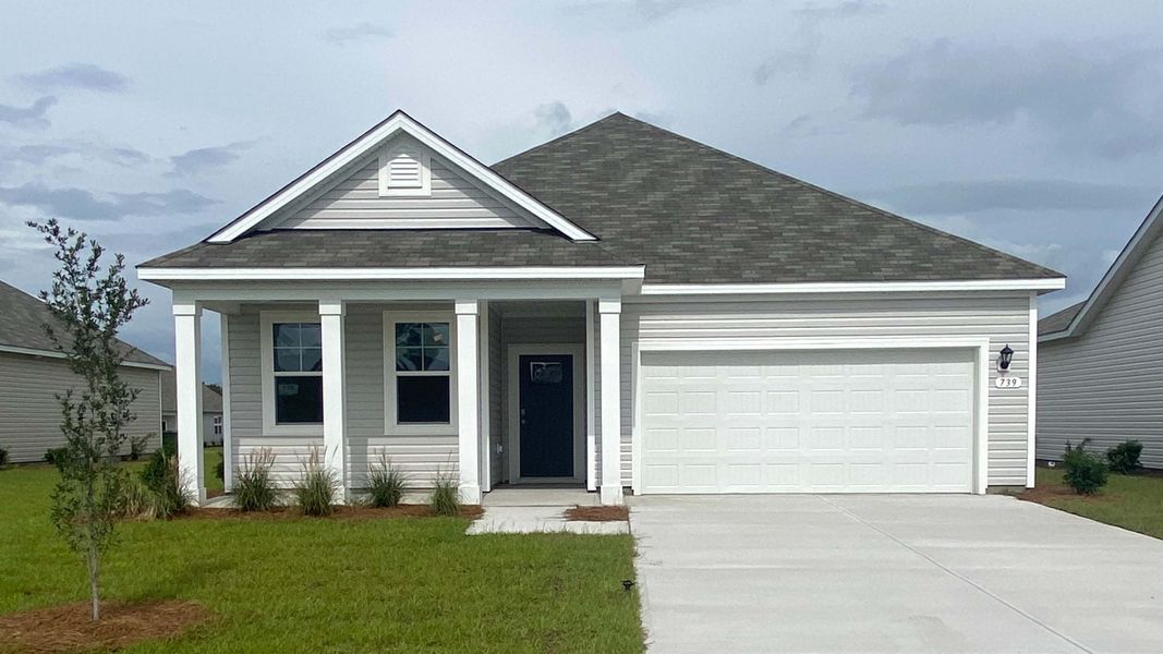 Front exterior of a new home in Stanbury Creek, Supply, NC, highlighting curb appeal (Image 1). Front exterior of a new home in Stanbury Creek, Supply, NC, highlighting curb appeal (Image 1).