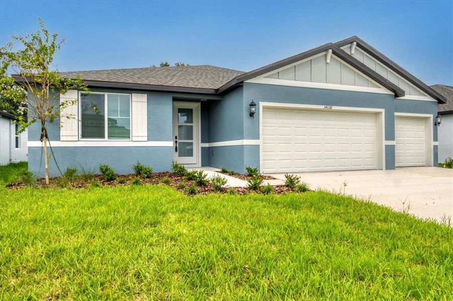 Front exterior of a new home in , Parrish, FL, highlighting curb appeal (Image 20).