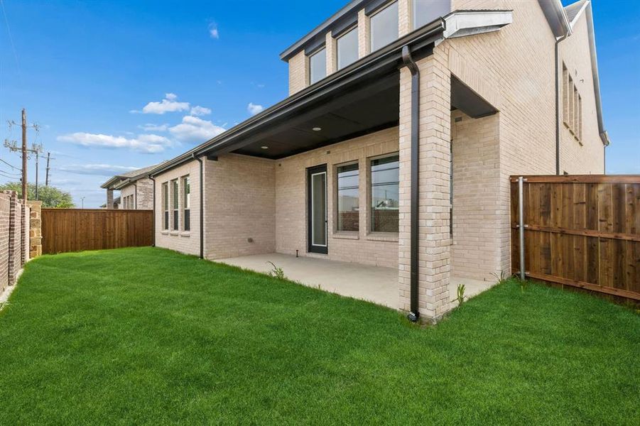 Dining al fresco is in your future on this lovely covered back patio with private fenced yard!
