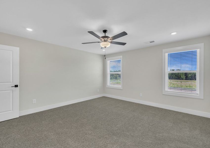 The master bedroom has ample space for your king-sized furniture.