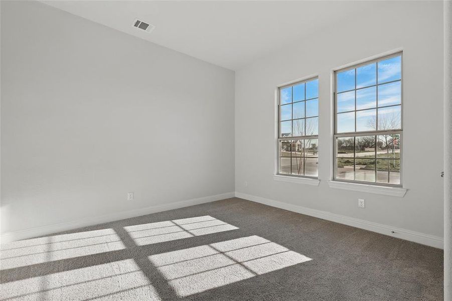 Unfurnished room with carpet floors and baseboards