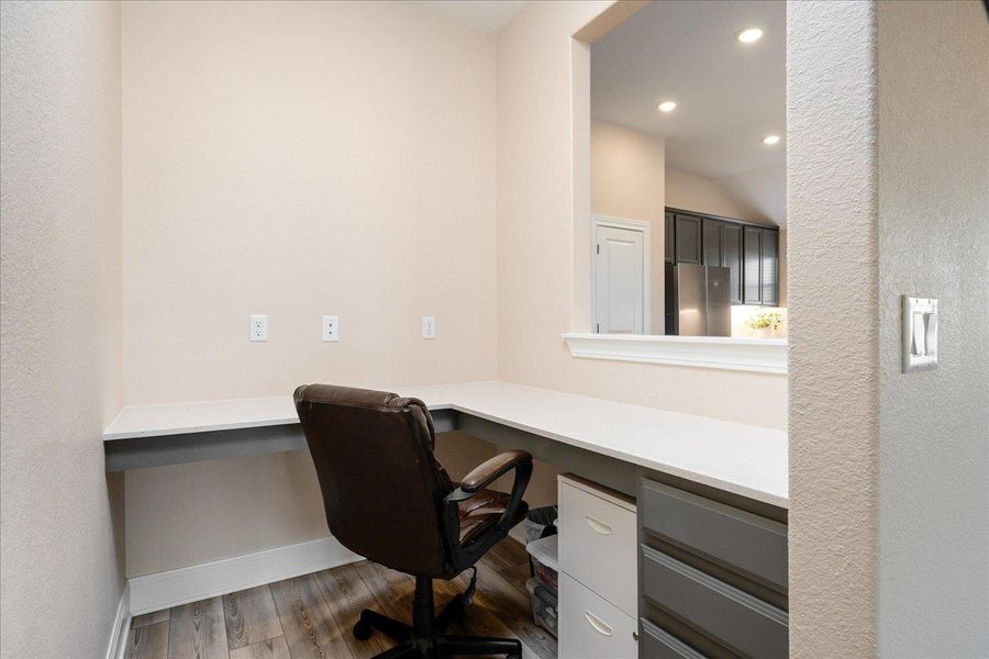 Built-in office nook off kitchen and living room.
