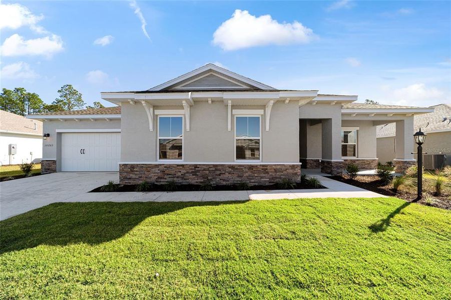 Front exterior of a new home in , Ocala, FL, highlighting curb appeal (Image 22). Front exterior of a new home in , Ocala, FL, highlighting curb appeal (Image 22).