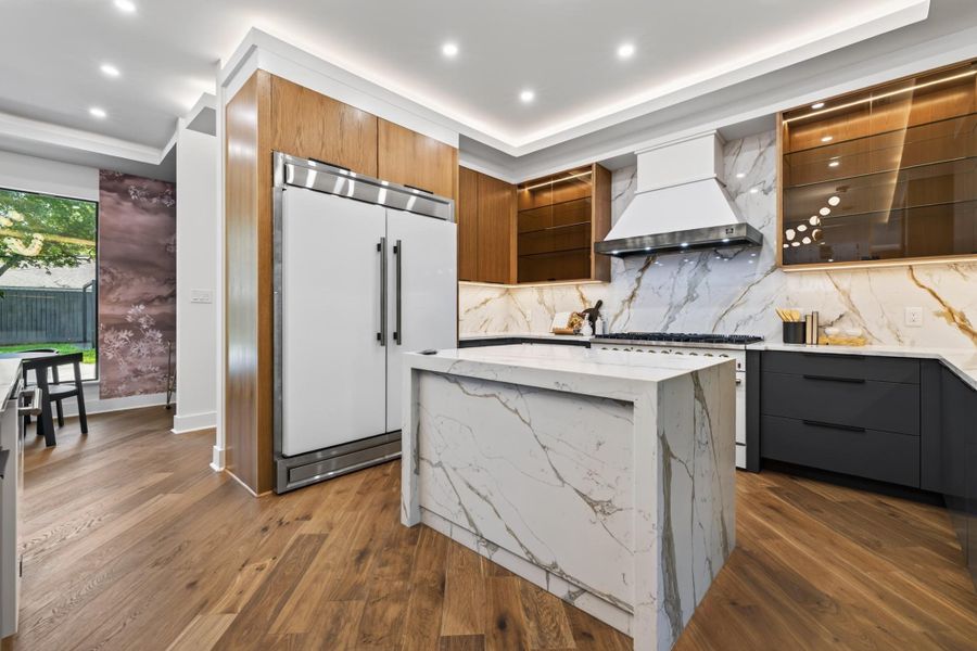The generous island provides exceptional prep space, storage and a natural gathering place for guests.