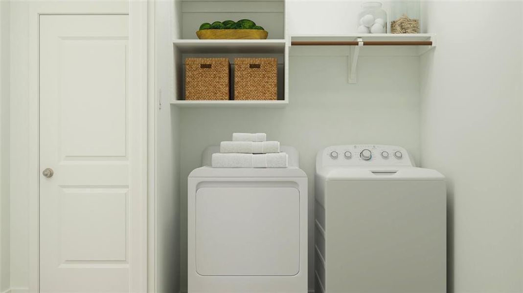 Laundry room with washer and clothes dryer