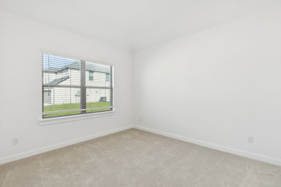 Bedroom in the Gilmour II home plan by Trophy Signature Homes – REPRESENTATIVE PHOTO