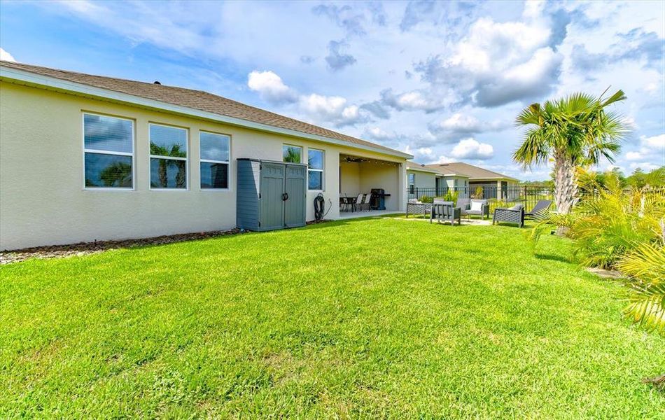 Exterior details and patio area of a home in Archers Mill, Ormond Beach (Image 31).