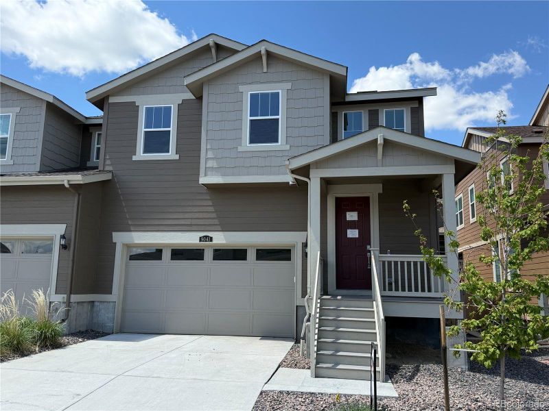 Front exterior of a new home in , Parker, CO, highlighting curb appeal (Image 1).