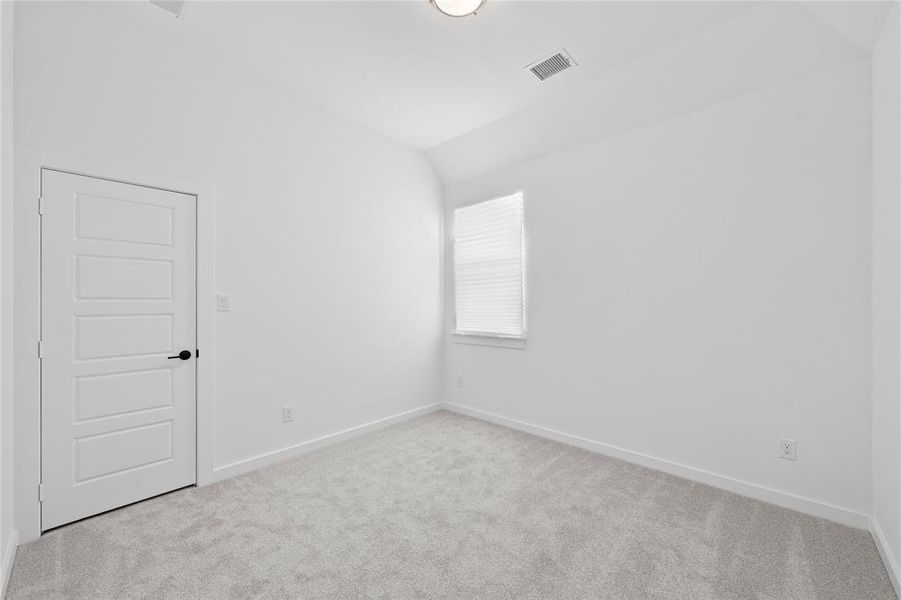 Neutral-toned carpet flooring complementing white walls and trim