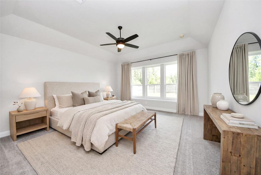 Relax and unwind after a long day in this impressive primary suite! This generously sized room offers plush carpet flooring, neutral-toned paint, high ceilings with a ceiling fan, and large windows for added comfort and tranquility. *Virtually Staged Relax and unwind after a long day in this impressive primary suite! This generously sized room offers plush carpet flooring, neutral-toned paint, high ceilings with a ceiling fan, and large windows for added comfort and tranquility. *Virtually Staged