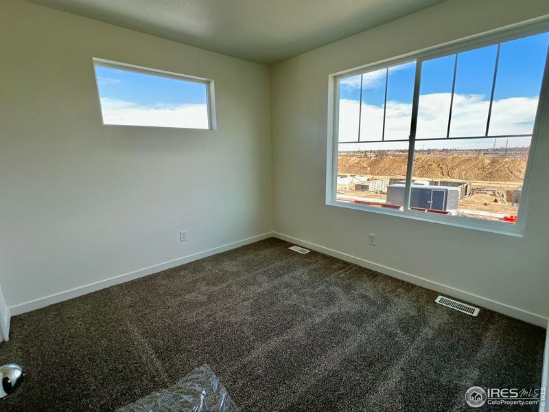 Spacious, unfurnished interior of a new home in Union Colony West, Greeley (Image 20).