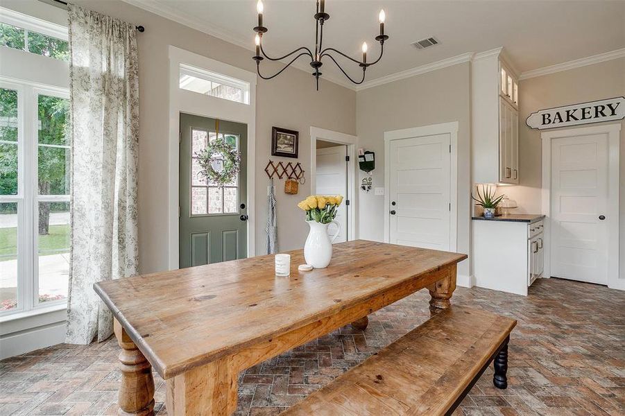 Breakfast nook with chandelier that is open to kitchen. Breakfast nook with chandelier that is open to kitchen.