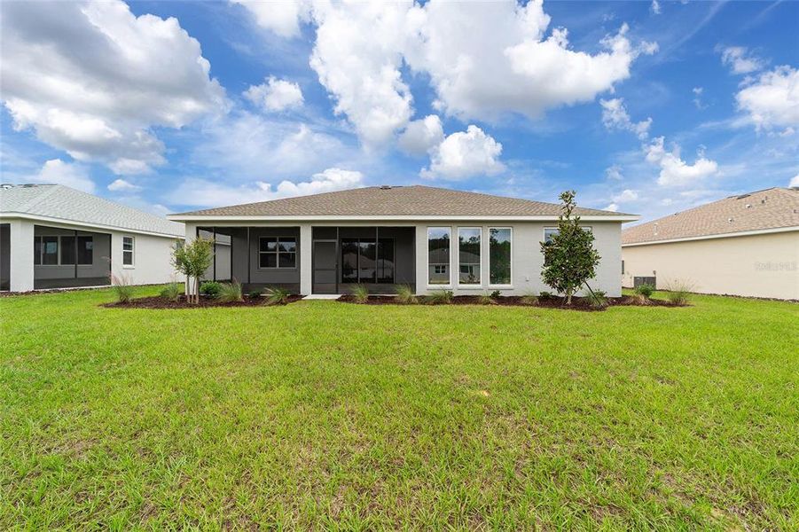 Exterior details and patio area of a home in On Top of the World Communities, Ocala (Image 3).