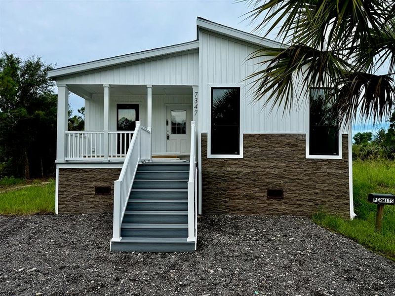 Front exterior of a new home in , Punta Gorda, FL, highlighting curb appeal (Image 27). Front exterior of a new home in , Punta Gorda, FL, highlighting curb appeal (Image 27).