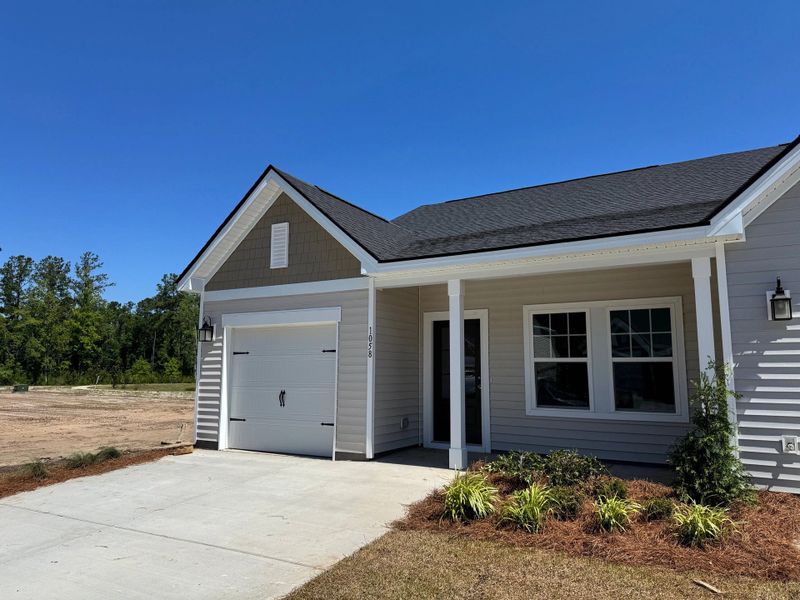 Front exterior of a new home in Hammock Walk at Nexton, Summerville, SC, highlighting curb appeal (Image 2). Front exterior of a new home in Hammock Walk at Nexton, Summerville, SC, highlighting curb appeal (Image 2).
