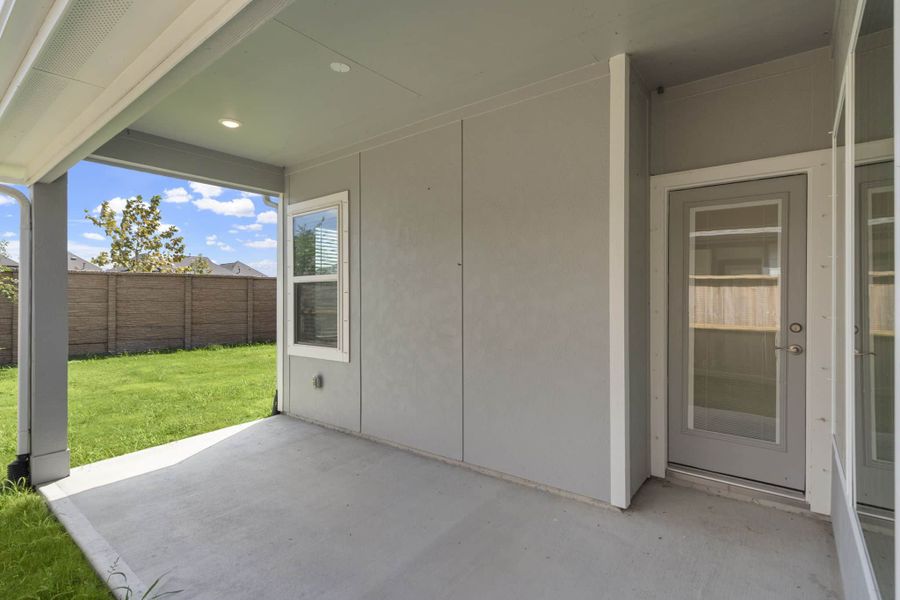 Exterior details and patio area of a home in Meridiana, Iowa Colony (Image 3).