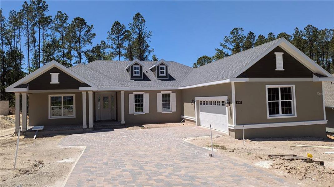 Front exterior of a new home in Southern Hills Plantation, Brooksville, FL, highlighting curb appeal (Image 1).
