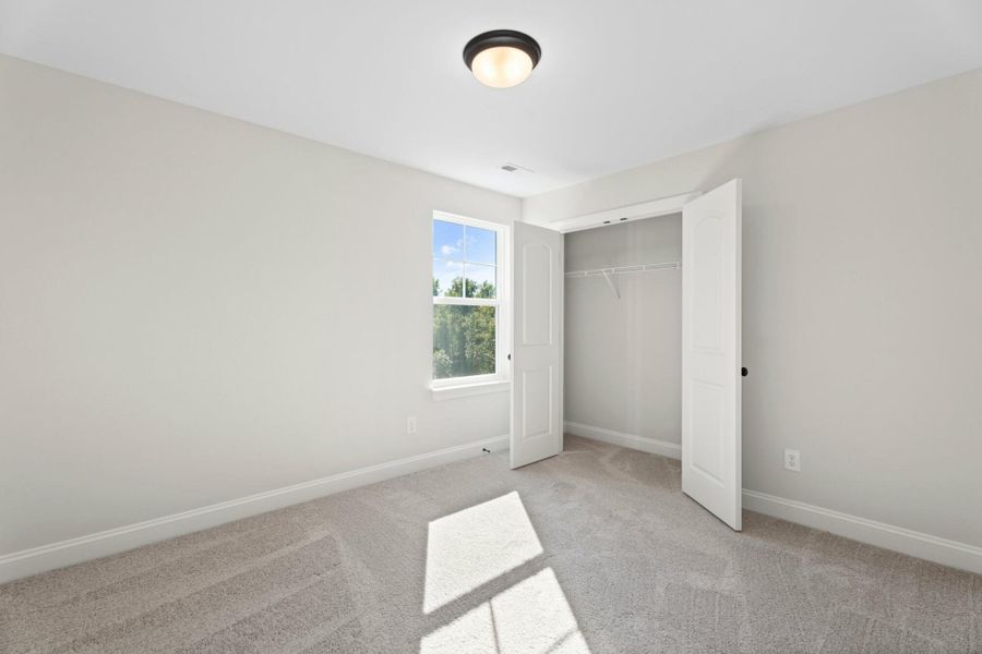 Spacious, unfurnished interior of a new home in Cottages at Piper Village, Trinity (Image 28).