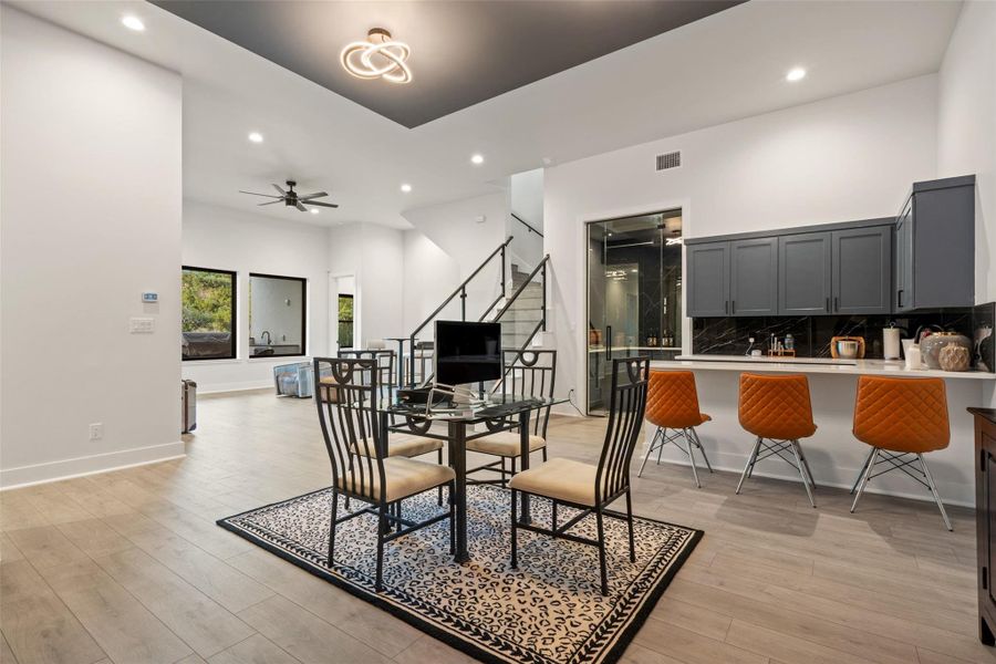 Designed for unforgettable entertaining, the lower level features a barrel-ceiling home theater, expansive game room, stylish bar, and temperature-controlled wine cellar.