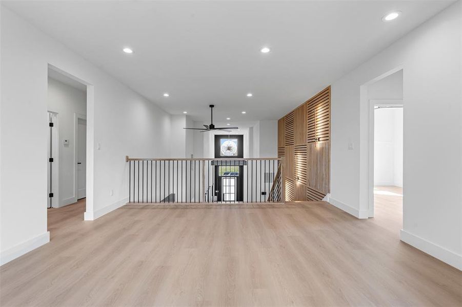 Empty room featuring recessed lighting, light wood-type flooring, and a ceiling fan