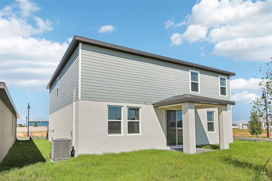 Exterior details and patio area of a home in Crosswinds - Signature Series, Haines City (Image 4).