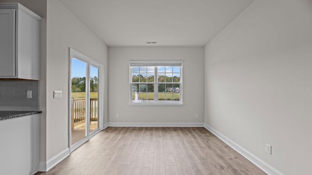 Representative unfurnished interior of a home built from the Mills by D.R. Horton in Tyler - Home on the Lake, New Bern (Image 10).