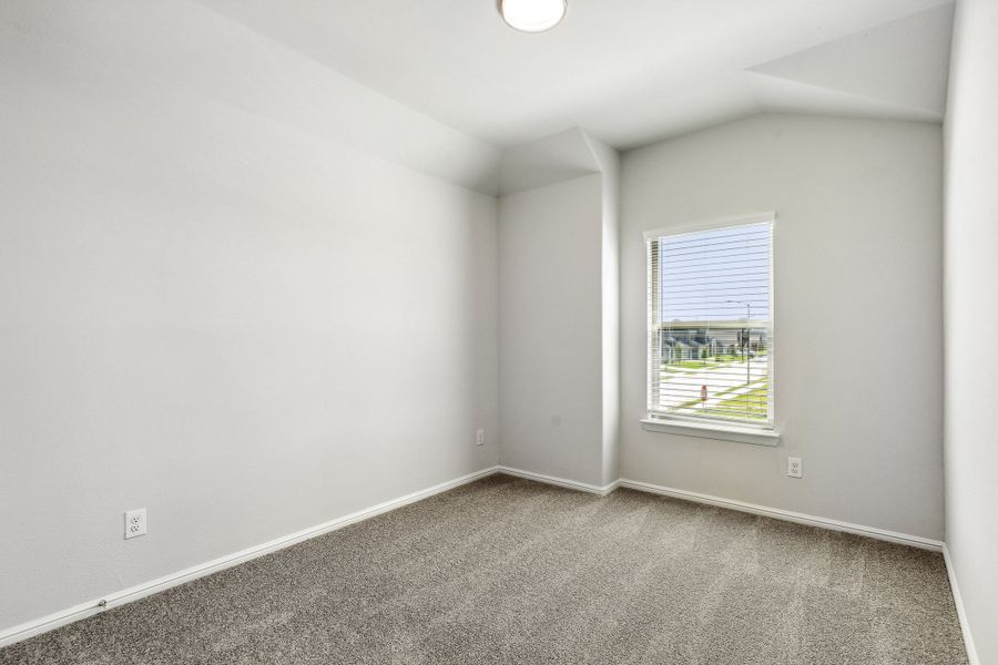 Bedroom in the Sapphire home plan by Trophy Signature Homes – REPRESENTATIVE PHOTO