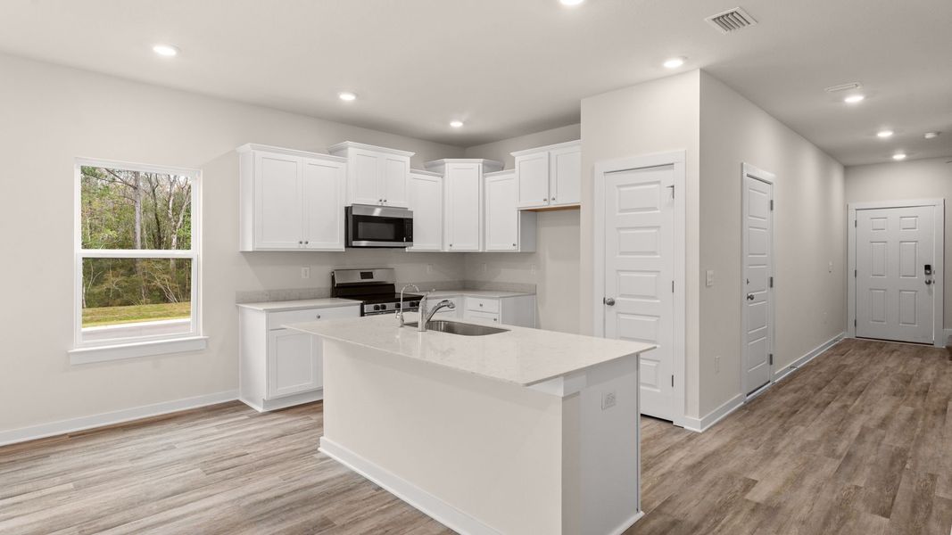 Furnished interior view inside a new home in Genoa Landing Townhomes, Freeport (Image 6).