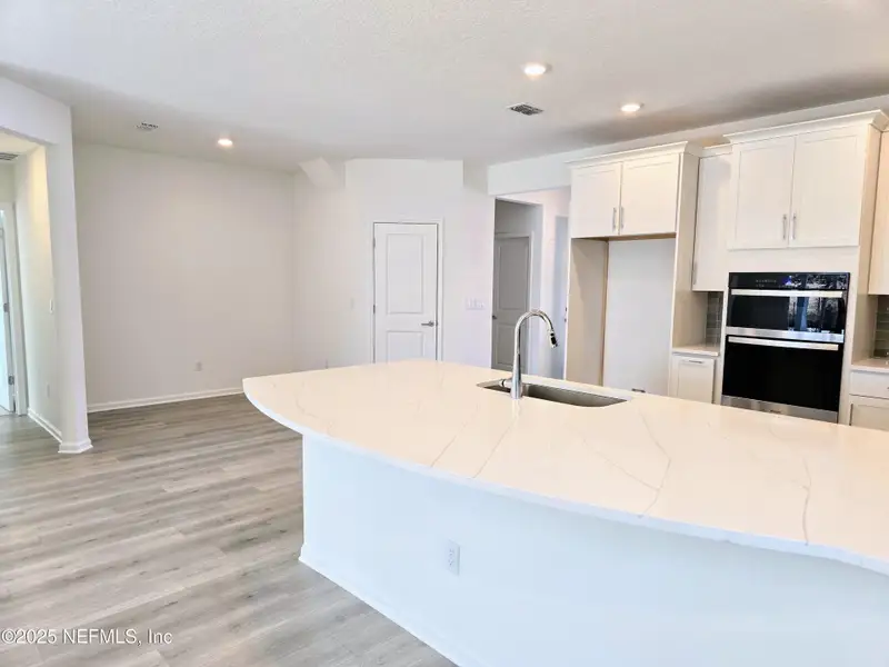 Furnished interior view inside a new home in Amberly, Green Cove Springs (Image 3).