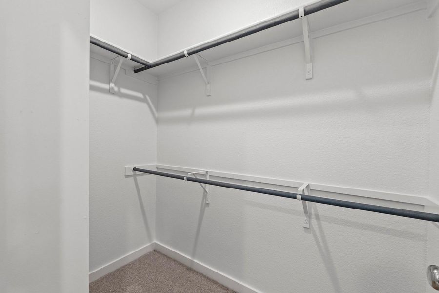 Primary Closet in the Pearl home plan by Trophy Signature Homes – REPRESENTATIVE PHOTO Primary Closet in the Pearl home plan by Trophy Signature Homes – REPRESENTATIVE PHOTO