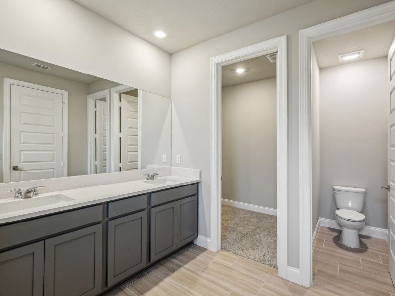 Primary Bathroom in the Onyx floorplan at 6406 NW Sweetwood Drive