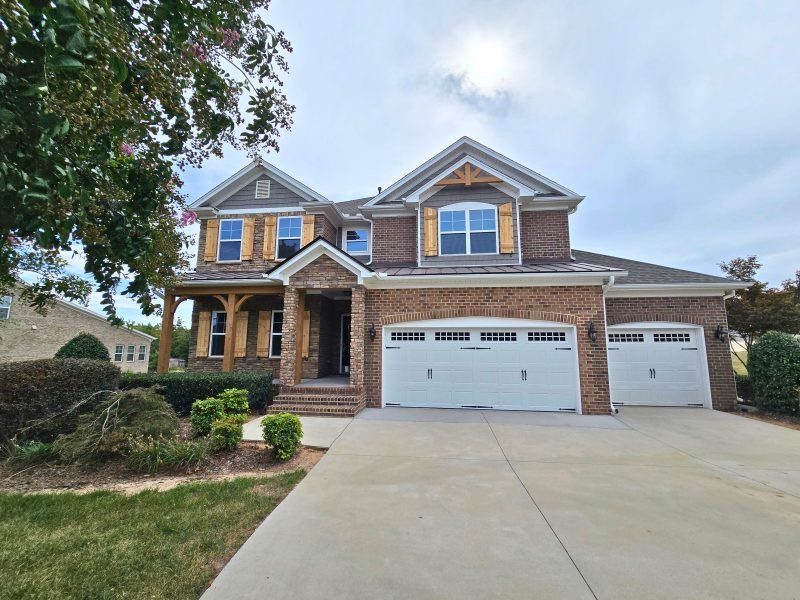 Representative exterior photo of a completed home built from the Hanover Lux by Keystone Homes NC in Northwest Meadows, Stokesdale, NC (Image 41). Representative exterior photo of a completed home built from the Hanover Lux by Keystone Homes NC in Northwest Meadows, Stokesdale, NC (Image 41).
