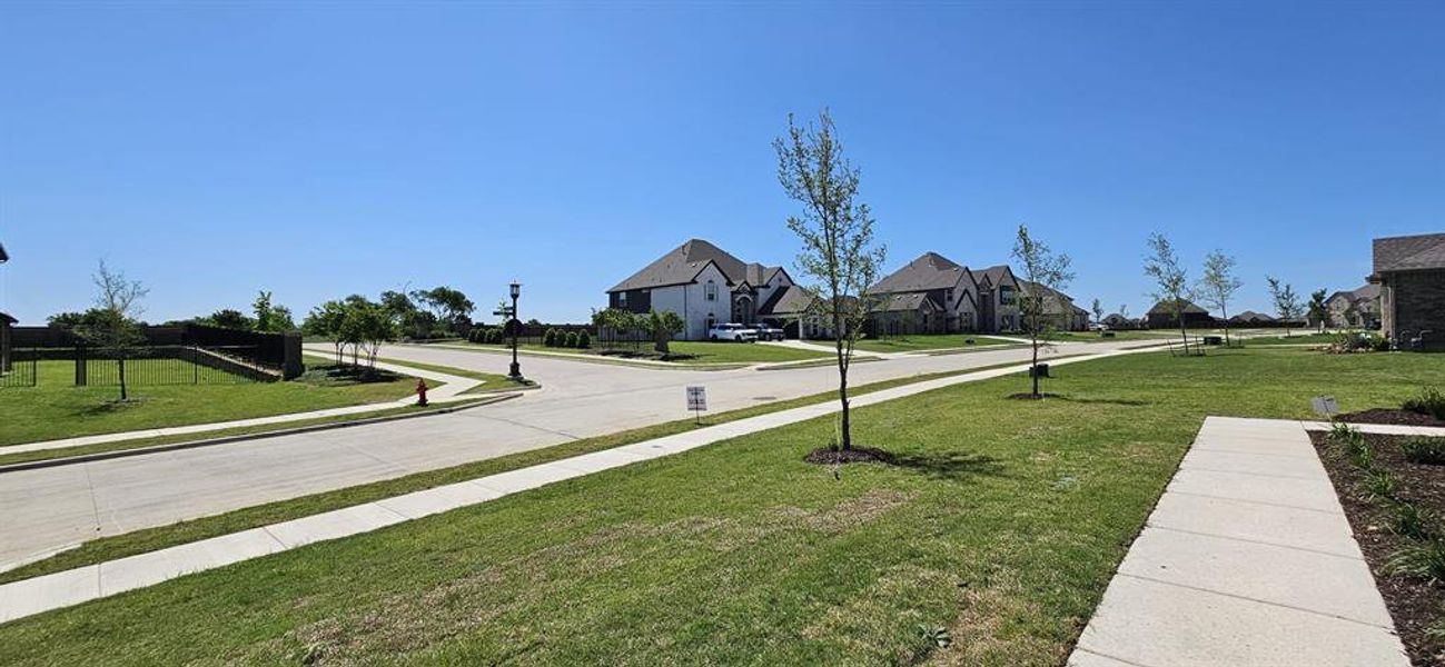 Front exterior of a new home in , Haslet, TX, highlighting curb appeal (Image 21).