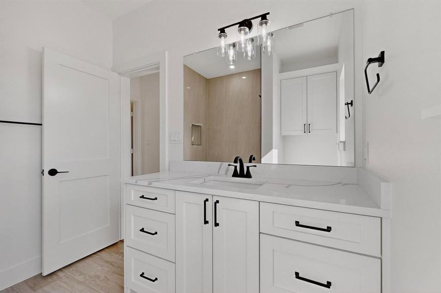 Bathroom with vanity and light wood-type flooring