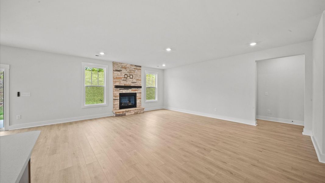 Hardwood flooring and high standards define this vibrant family room ideal for everyday living