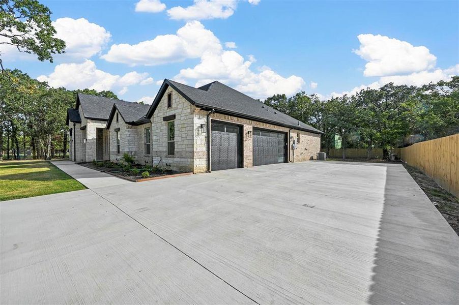 View of side of home with a garage