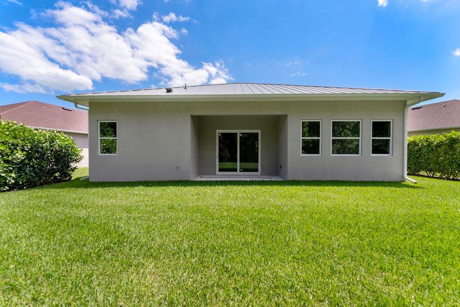 Front exterior of a new home in , Port St. Lucie, FL, highlighting curb appeal (Image 13).