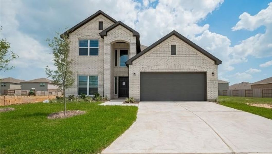 Front exterior of a new home in Sunterra, Park Row, TX, highlighting curb appeal (Image 1). Front exterior of a new home in Sunterra, Park Row, TX, highlighting curb appeal (Image 1).