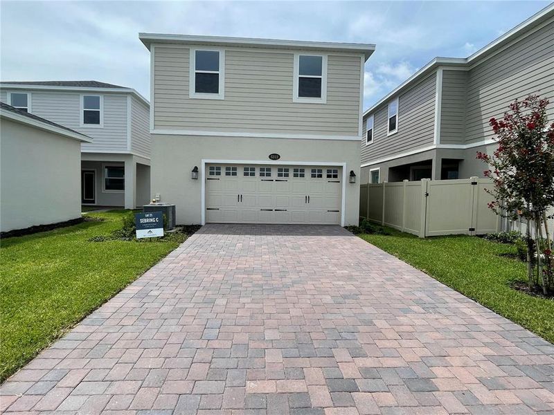 Exterior details and patio area of a home in Center Lake on the Park, St. Cloud (Image 1).