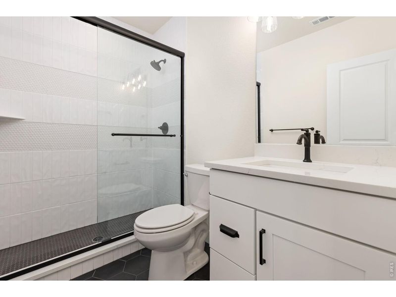 Furnished interior view inside a new home in RainDance, Windsor (Image 11).