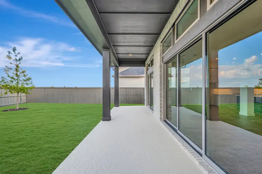 Exterior details and patio area of a home in Goodland – Manor Series, Grand Prairie (Image 3). Exterior details and patio area of a home in Goodland – Manor Series, Grand Prairie (Image 3).