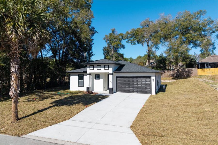 Front exterior of a new home in , Deland, FL, highlighting curb appeal (Image 28).