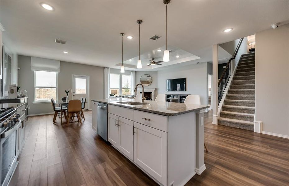 *Model Representation - Large island overlooking gathering room and dining areas