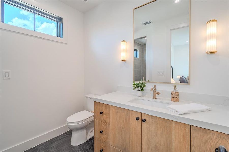Bathroom with vanity and a shower