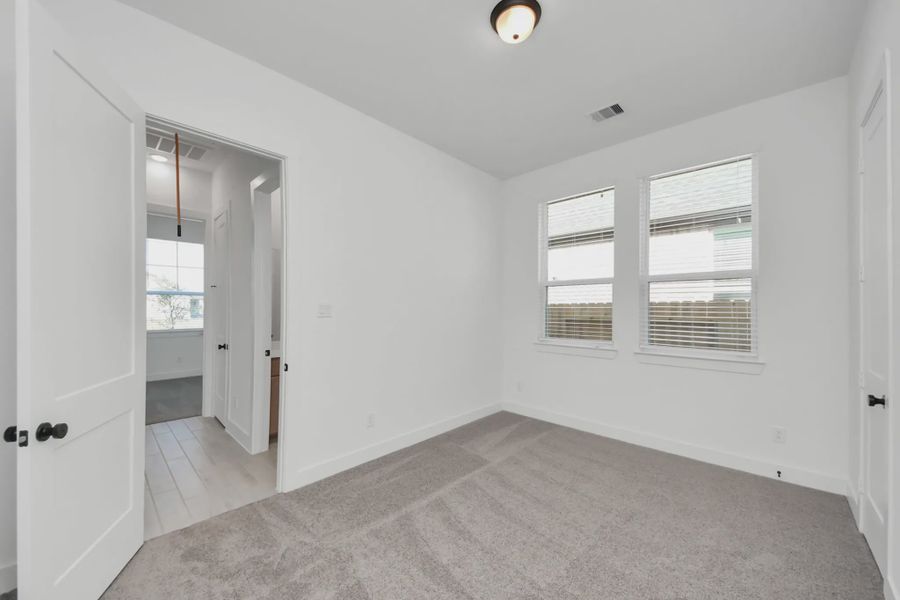 Representative unfurnished interior of a home built from the Summerton by Chesmar Homes in Meridiana 50's and 60's, Manvel (Image 53).