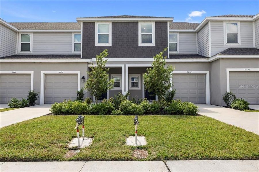 Front exterior of a home in the The Townhomes at Azario Lakewood Ranch community, located in Bradenton, FL (Image 8).